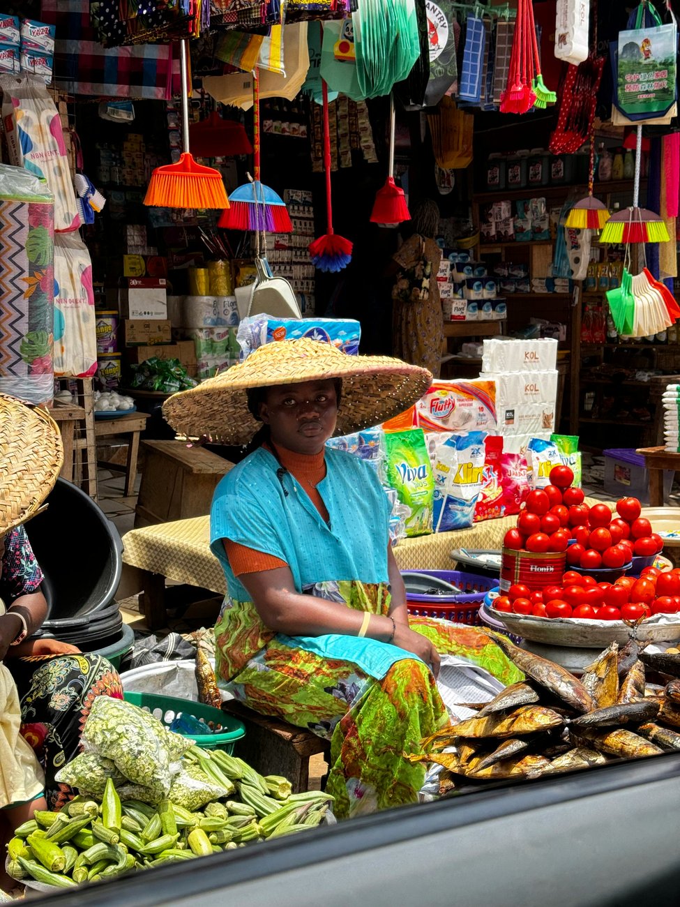 A produce seller at a neighbourhood market in Accra